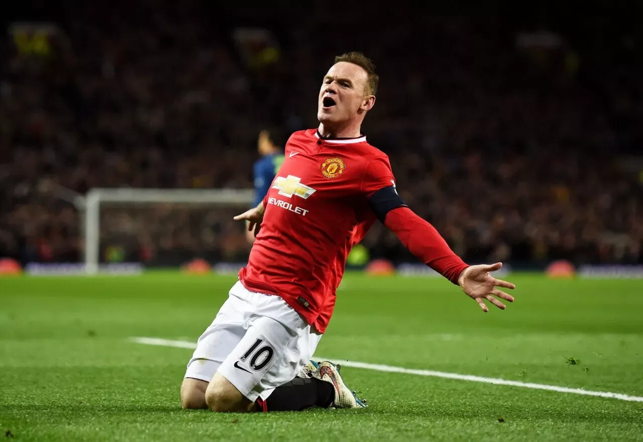 MANCHESTER, ENGLAND - MARCH 09: Wayne Rooney of Manchester United celebrates after scoring a goal to level the scores at 1-1 during the FA Cup Quarter Final match between Manchester United and Arsenal at Old Trafford on March 9, 2015 in Manchester, England. (Photo by Laurence Griffiths/Getty Images)
