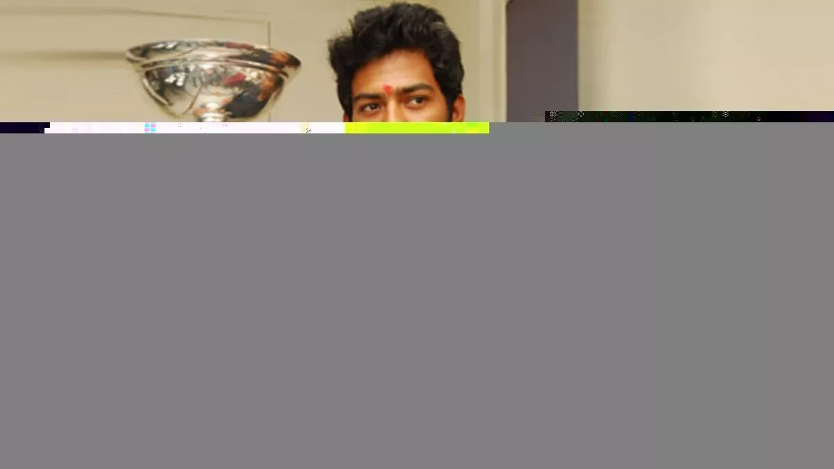 Unmukt Chand poses with the U19 World Cup 2012 trophy