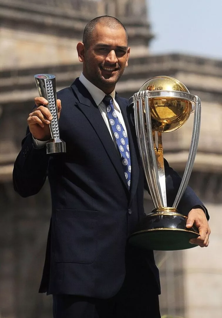 MS Dhoni poses with the ICC Cricket World Cup 2011 trophy