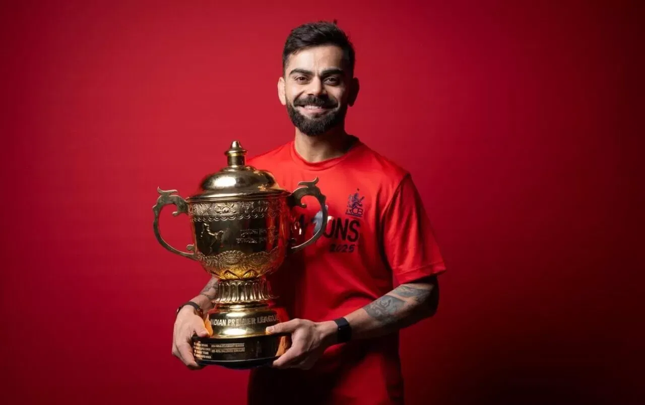 Virat Kohli poses with IPL 2025 trophy