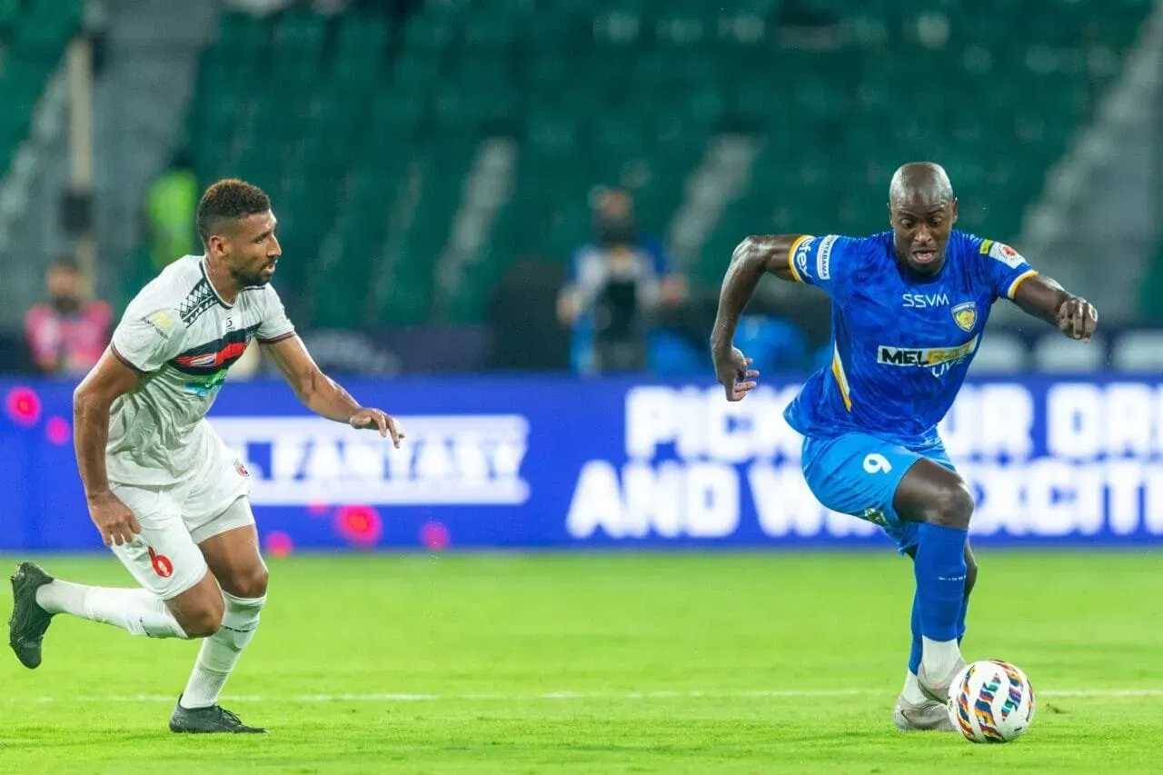 Chennaiyin FC's former striker Wilmar Jordan and Chennaiyin FC's current midfielder Ali Bemammer in action for NorthEast United FC