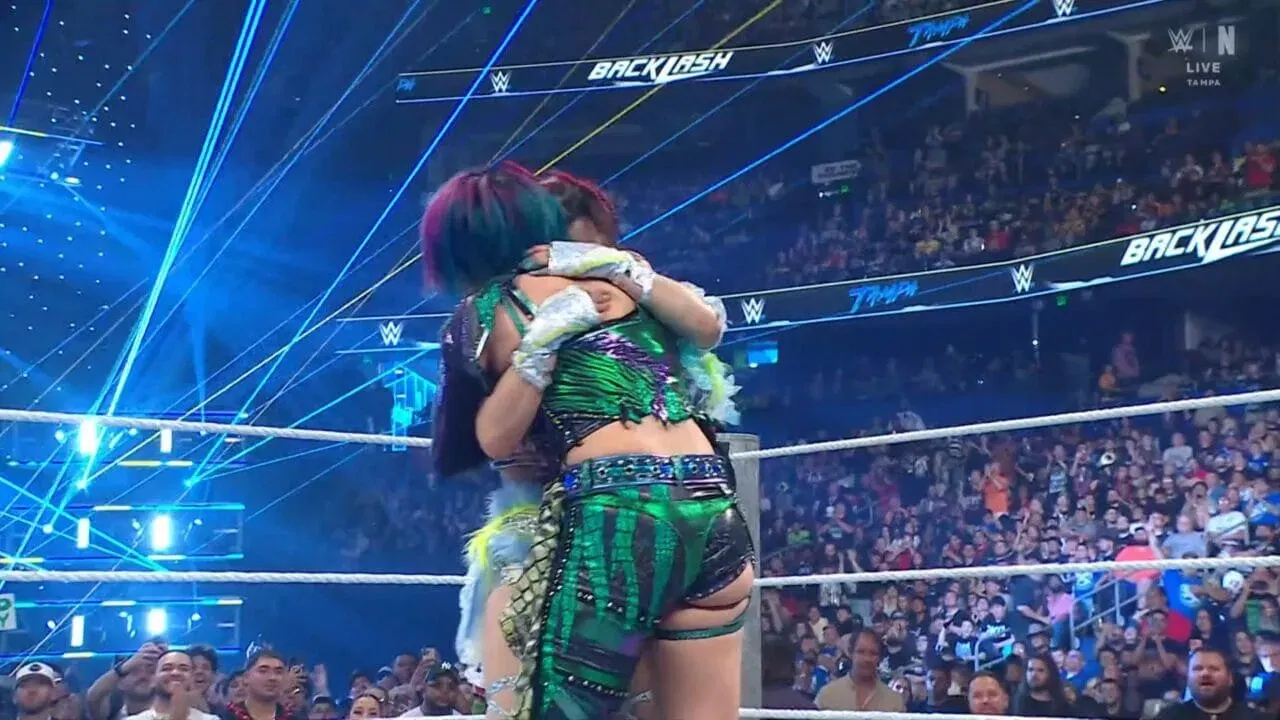 IYO SKY and Asuka embrace after their match