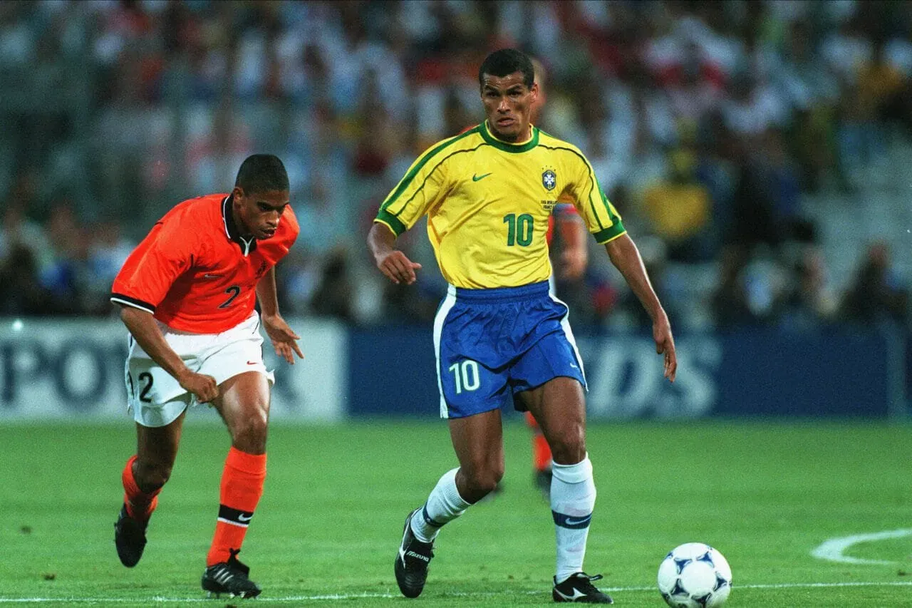 MARSEILLE, FRANCE - July 7: Rivaldo of Brazil and Michael Reiziger of Holland challenge during the FIFA World Cup Finals 1998 Semi-Final match between Brazil and Holland at Stade Velodrome on July 7, 1998 in Marseille, France. (Photo by Richard Sellers/Sportsphoto/Allstar via Getty Images)