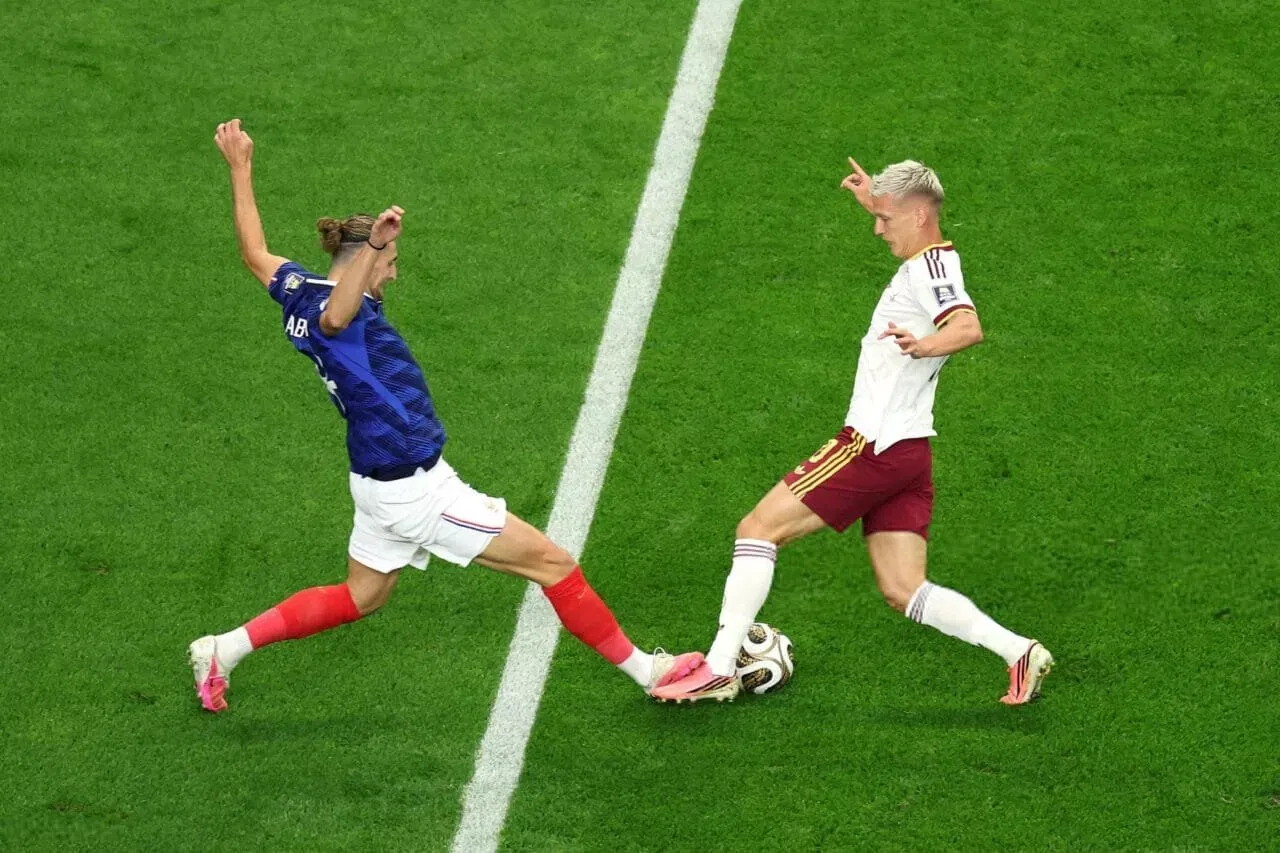 ARLINGTON, TEXAS - JULY 14: Adrien Rabiot #14 of France competes for the ball against Dani Olmo #10 of Spain during the FIFA World Cup 2026 Semi Final match between France and Spain at Dallas Stadium on July 14, 2026 in Arlington, Texas. (Photo by Kevin C. Cox/Getty Images)
