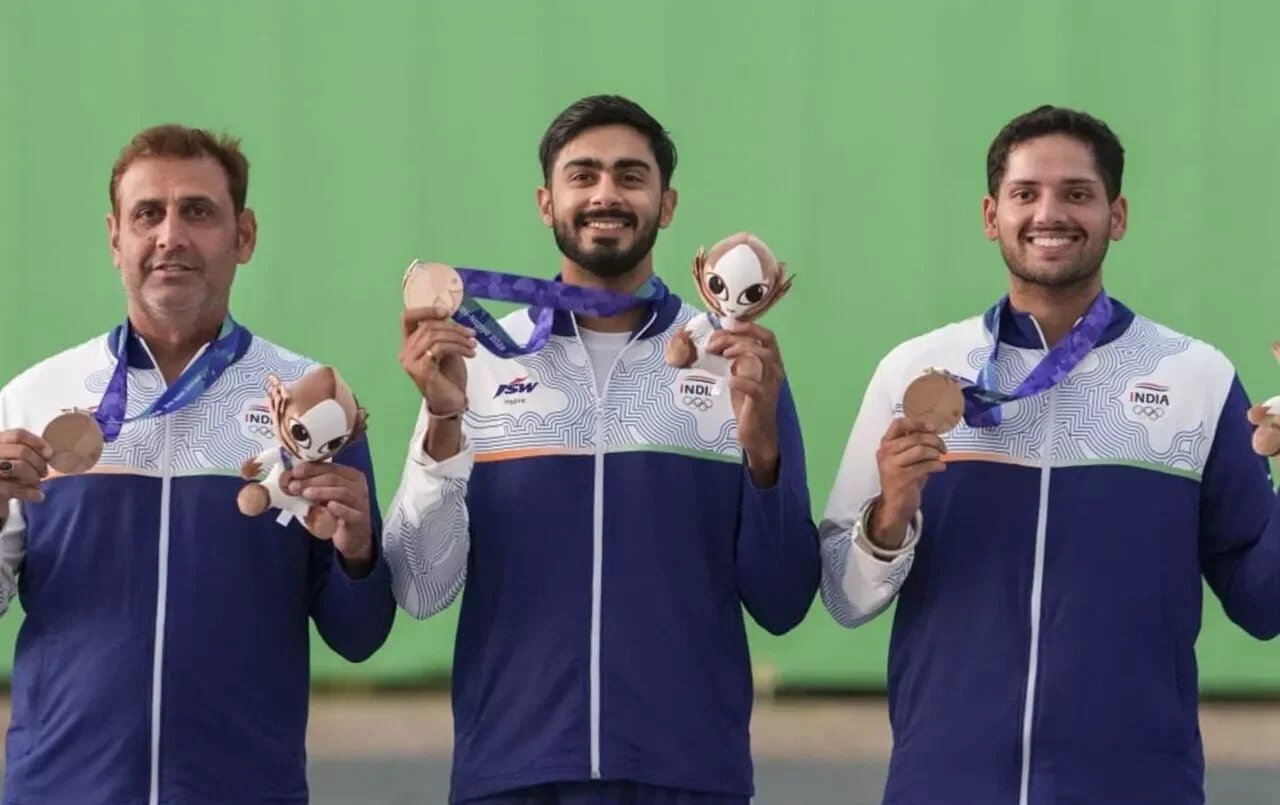Anantjeet Singh Naruka, Bhavtegh Singh Gill and Mairaj Ahmad Khan with the men’s skeet team medals at the Asian Games 2026.