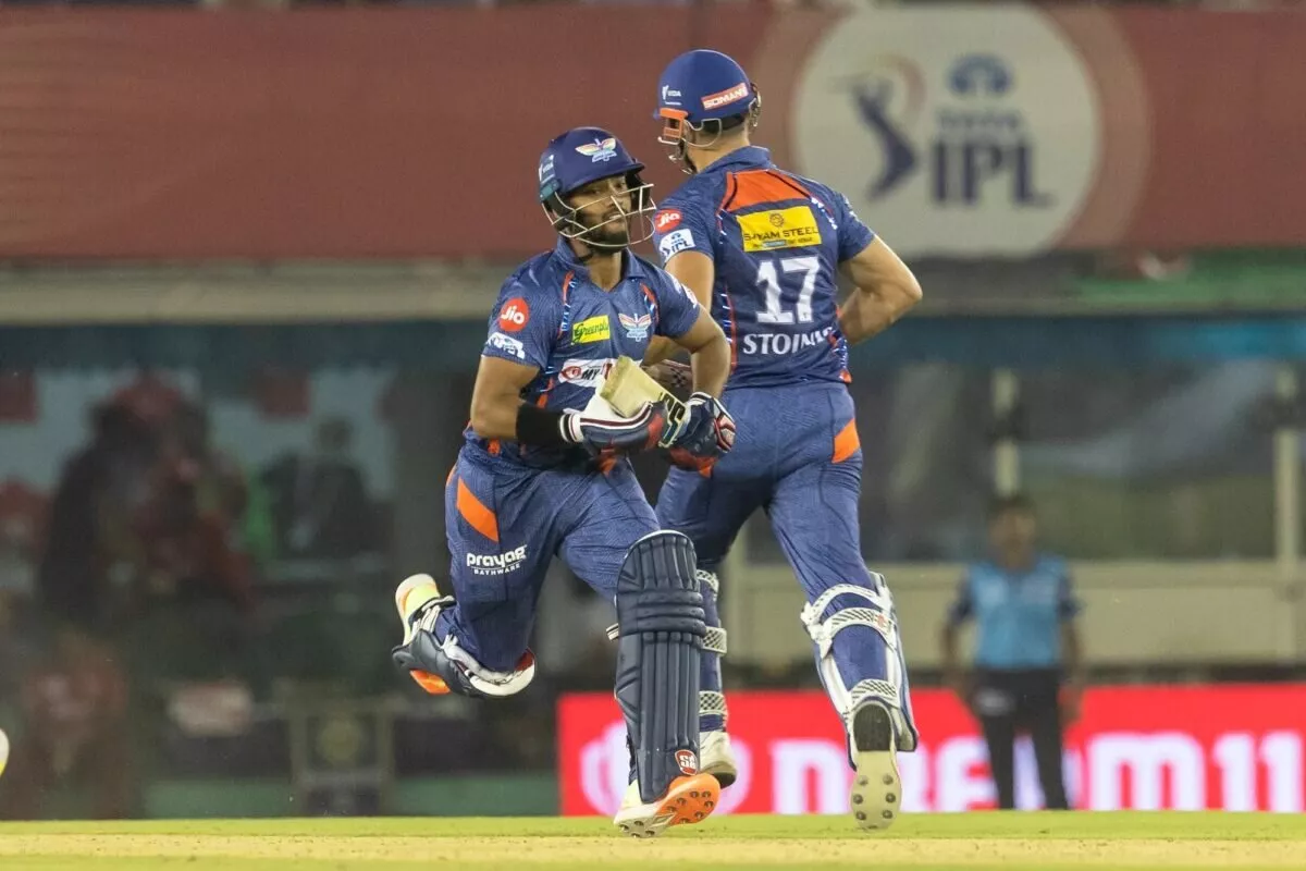 Lucknow Super Giants' batsmen Nicholas Pooran, Marcus Stoinis take a run