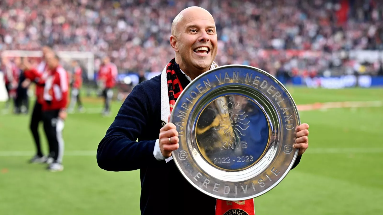  A photo of Dutch football manager Arne Slot, who is the current manager of Feyenoord Rotterdam, celebrating winning the 2022–23 KNVB Cup with his players in the background.