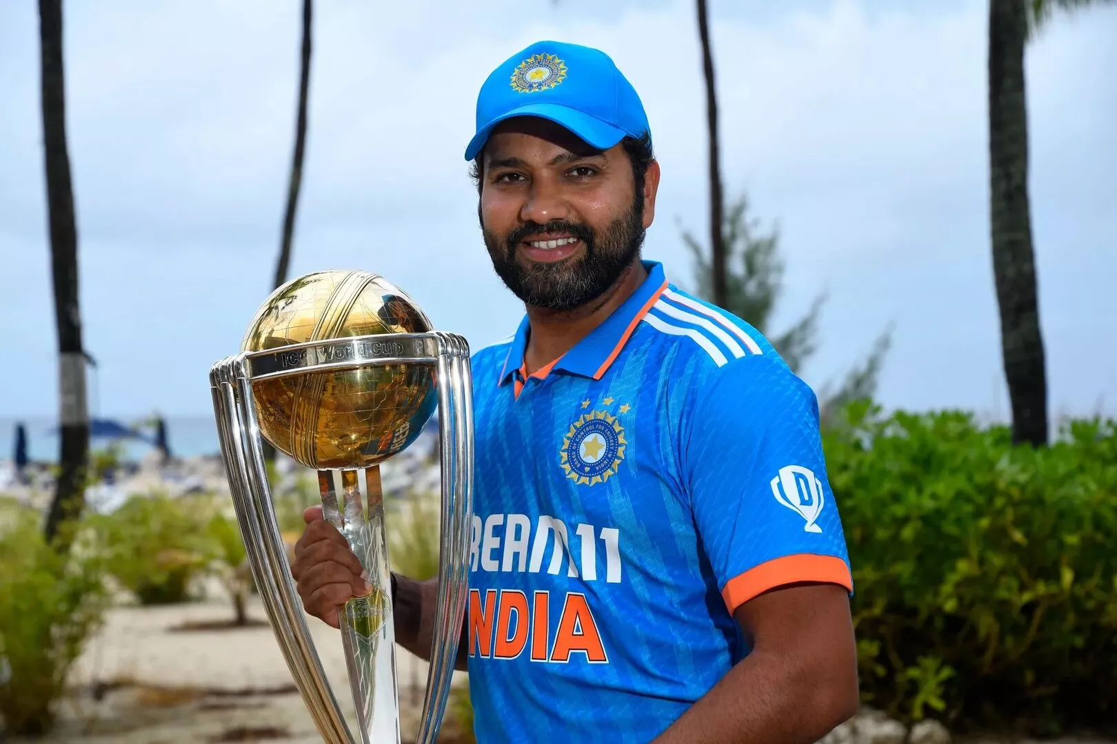 Indian captain Rohit Sharma poses with the ICC Cricket World Cup trophy