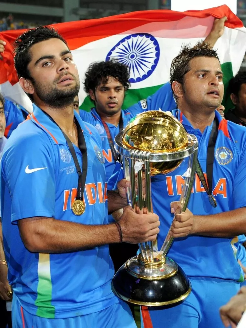 Virat Kohli, Suresh Raina with the ICC Cricket World Trophy in 2011