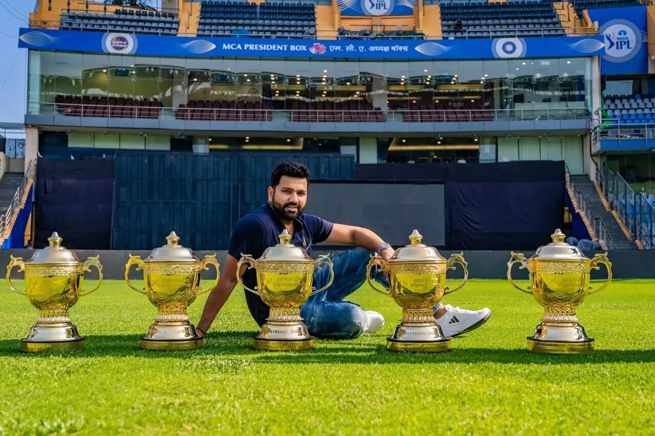 Rohit Sharma poses with the IPL titles won for MI