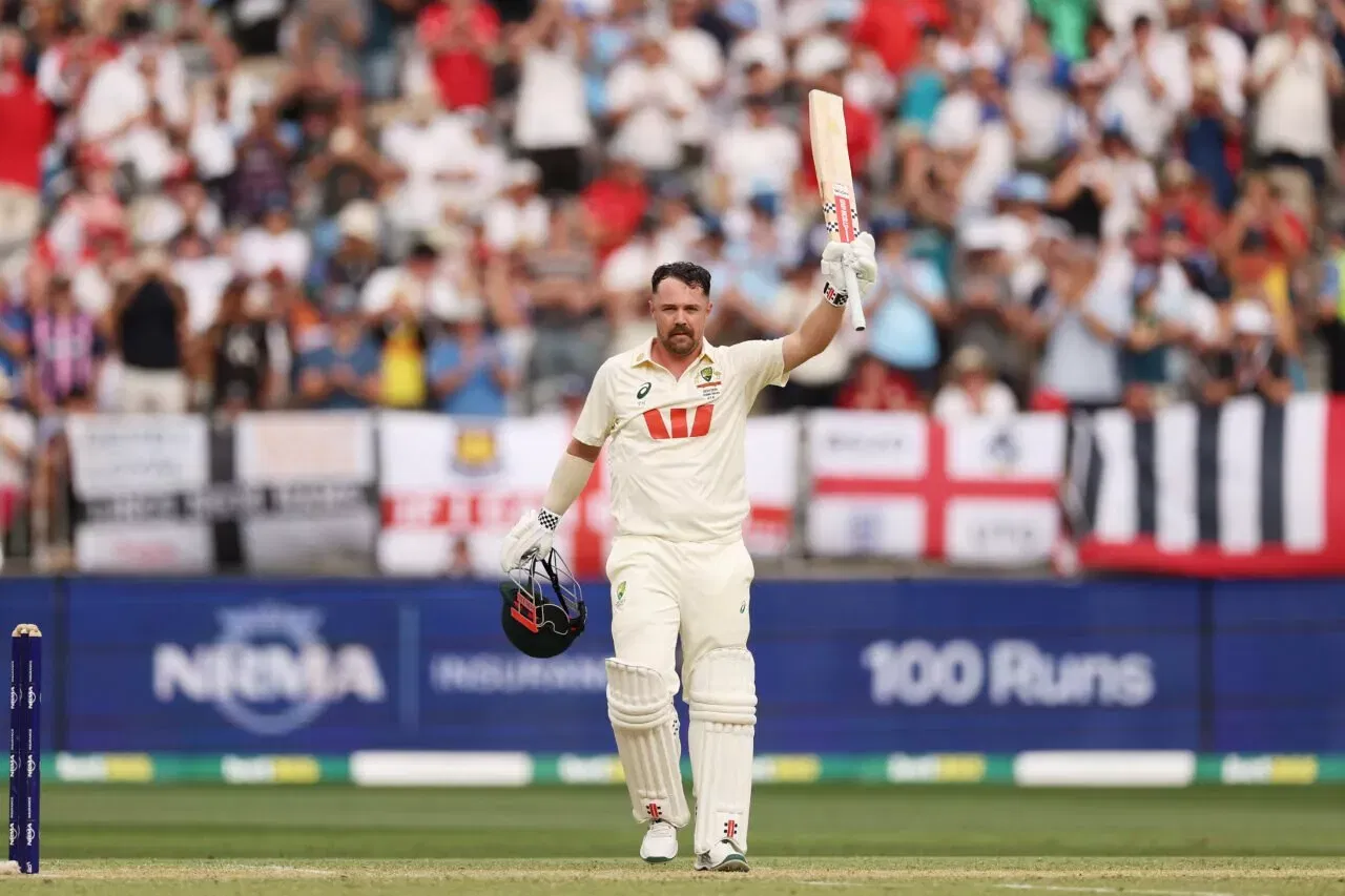 Travis Head celebrates his 69-ball test hundred