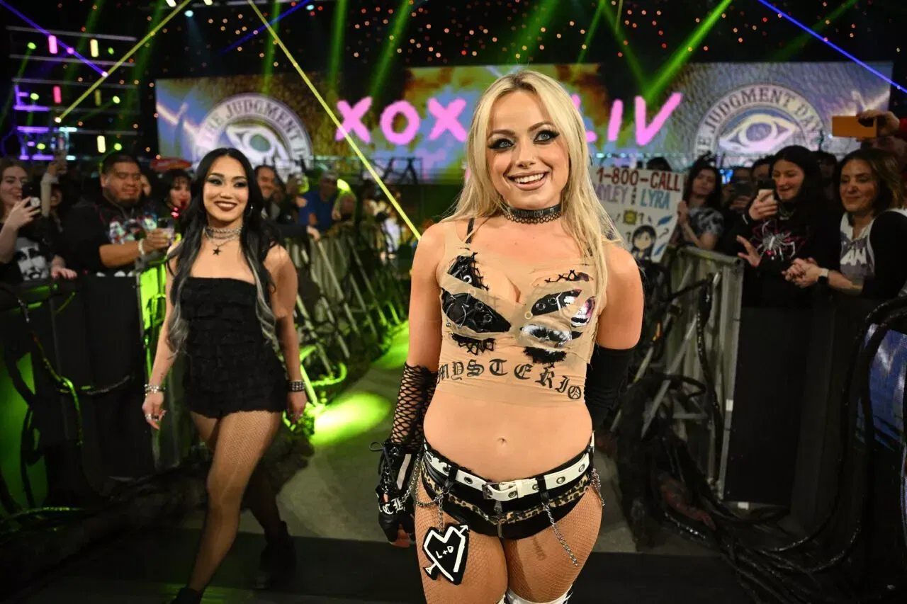 Liv Morgan enters the arena accompanied by Roxanne Perez during Monday Night WWE RAW Night of Champions 2026
