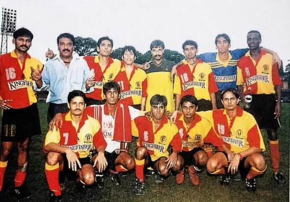 Which coaches have won National League titles with East Bengal?