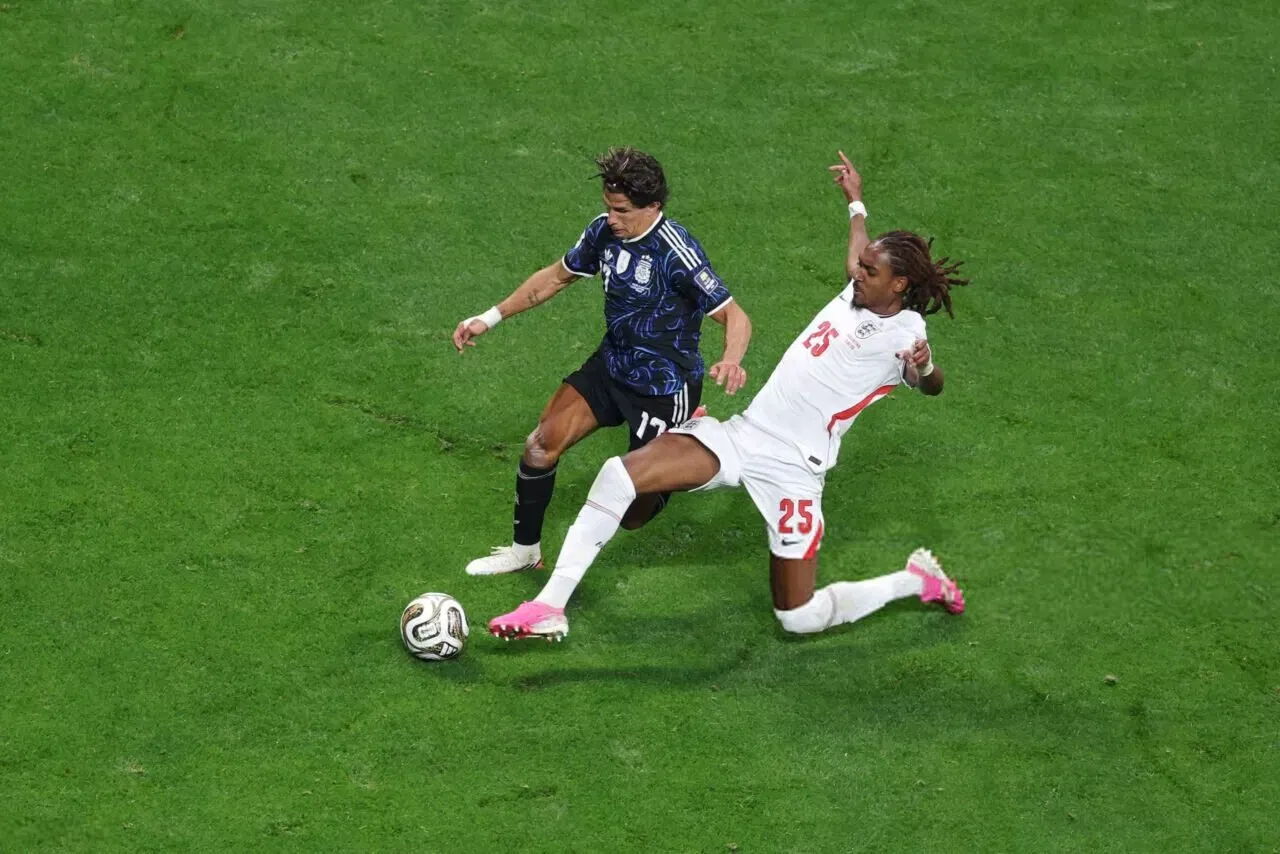 ATLANTA, GEORGIA - JULY 15: Djed Spence #25 of England makes a stop against Giuliano Simeone #17 of Argentina during the FIFA World Cup 2026 Semi Final match between England and Argentina at Atlanta Stadium on July 15, 2026 in Atlanta, Georgia. (Photo by Steph Chambers - FIFA/FIFA via Getty Images)