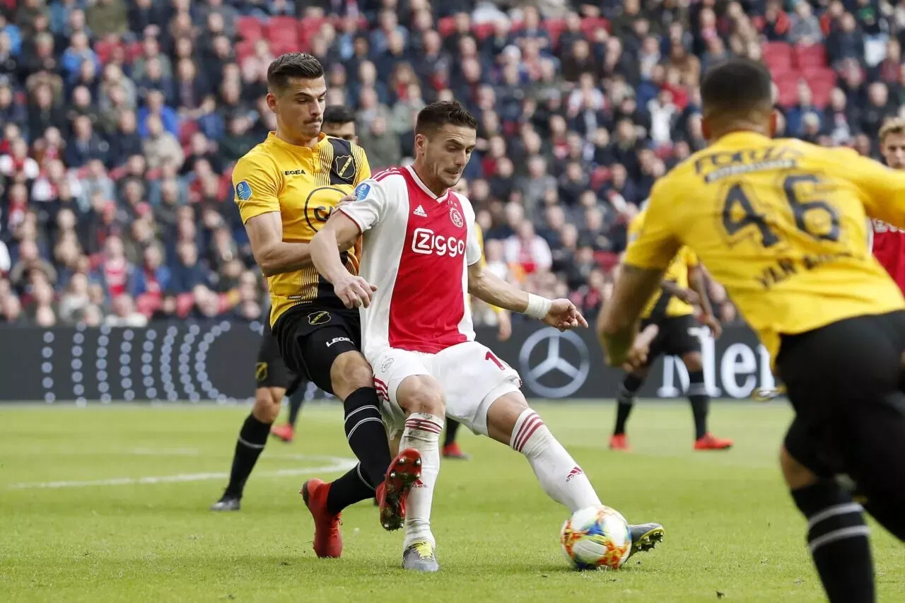 (L-R) Menno Koch of NAC Breda, Dusan Tadic of Ajax, during the Dutch Eredivisie match between Ajax Amsterdam and NAC Breda at the Johan Cruijff Arena on February 17, 2019 in Amsterdam, The Netherlands(Photo by VI Images via Getty Images)